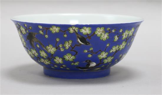 A Chinese blue ground prunus and blackbird bowl, bearing Qianlong mark to the base, diameter 14cm